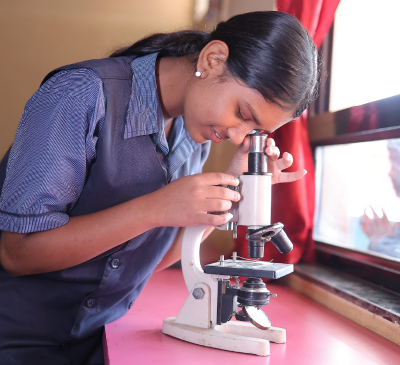 Student using microscope